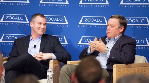 two men on stage during panel 