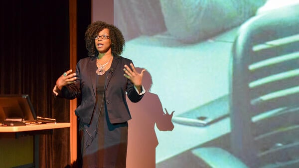 Dr. Kimberly Scott giving a presentation on WOC in STEM