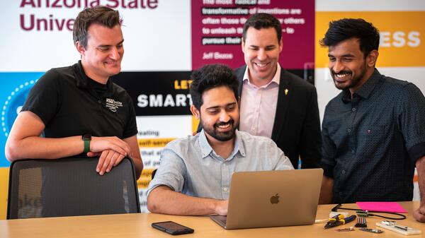 ASU students and Cloud Innovation Center interns working on a project at the CIC with ASU General Manager Ryan Hendrix.