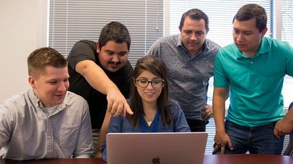 McKesson Vice President of Cybersecurity Operations and Services Paul Black (second from right) hired on the first class of interns from Arizona State University's Ira A. Fulton Schools of Engineering and W. P. Carey School of Business in summer 2017. 