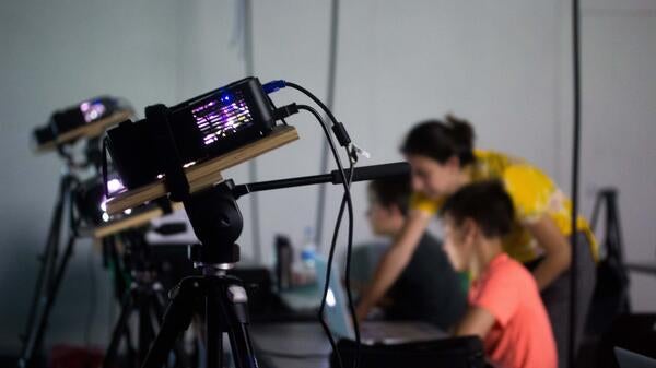 Middle students and professors doing projection mapping