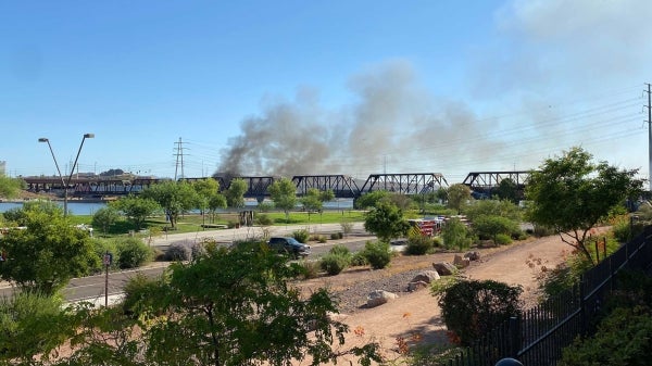 A train derailed on a bridge across Tempe Town Lake