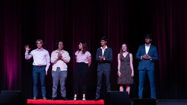 Group of ASU students standing on a stage.