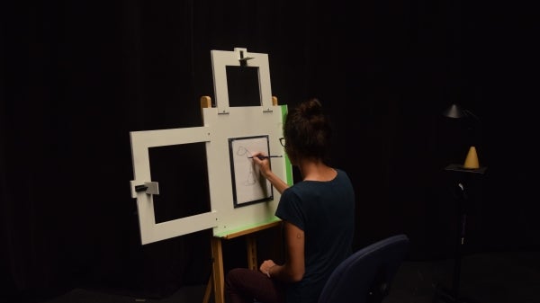 Photo of artist drawing