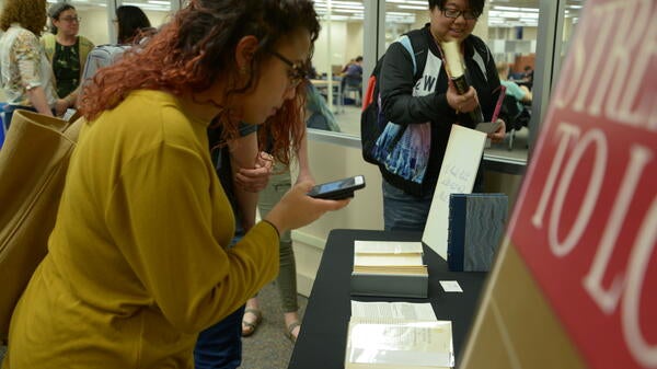 Students view signed copies of Martin Luther King Jr. Strength to Love Stride Toward Freedom