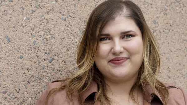 College of Liberal Arts and Sciences alumna Adisa Podrug in front of Armstrong Hall.