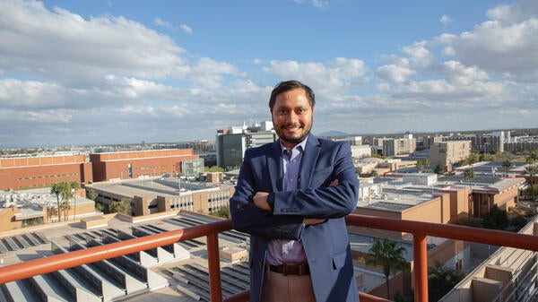 Anamitra Pal poses on the rooftop of a building on ASU's Tempe campus.