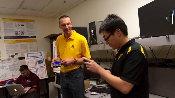 Martin Reisslein with students in his lab