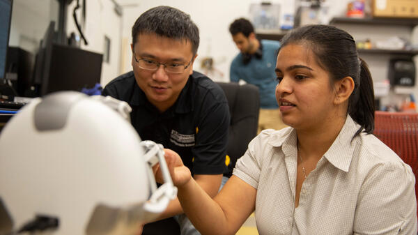 Professor and student working together in a lab