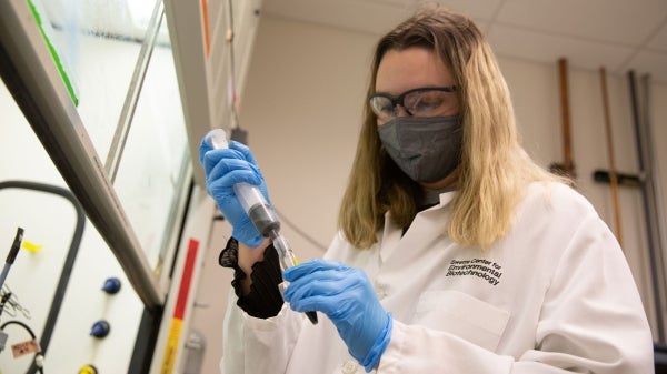 Smith Pittman conducts research in the lab.