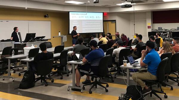 Doug Bingham, senior director of manufacturing technology for Honeywell and guest lecturer, discusses additive manufacturing concepts with a class of engineering students at the Polytechnic campus.