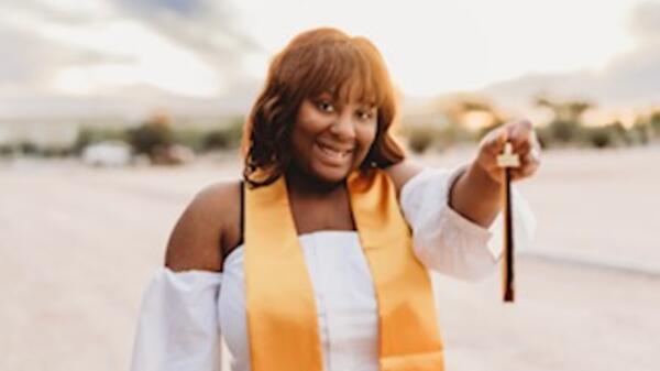 Portrait of ASU alum DaMonee Eaton wearing graduation regalia.