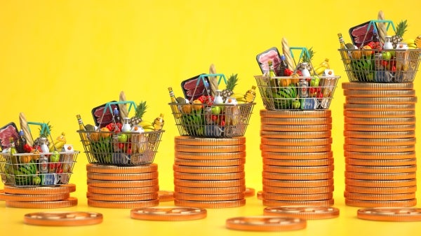 Illustration showing grocery baskets of food on top of increasingly taller piles of coins