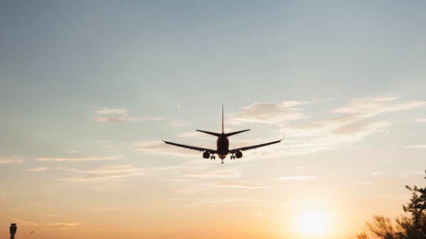 A plane flying in to Sky Harbor Airport 