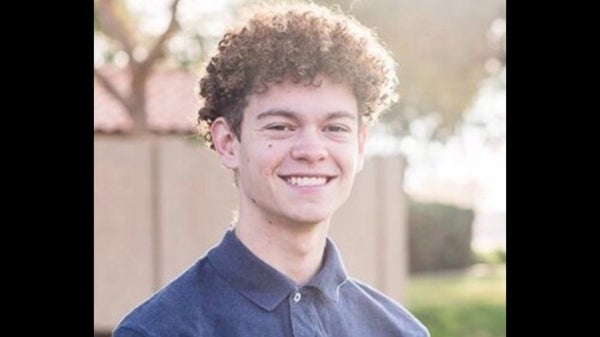 headshot of man outside