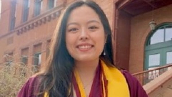 student's portrait in graduation gown