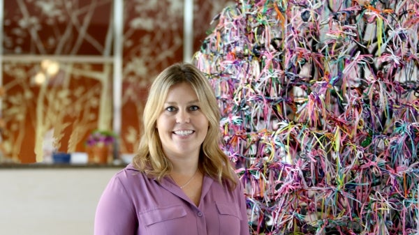 ASU master of counseling alum Katarina Scott in lobby at Banner MD Anderson Cancer Center