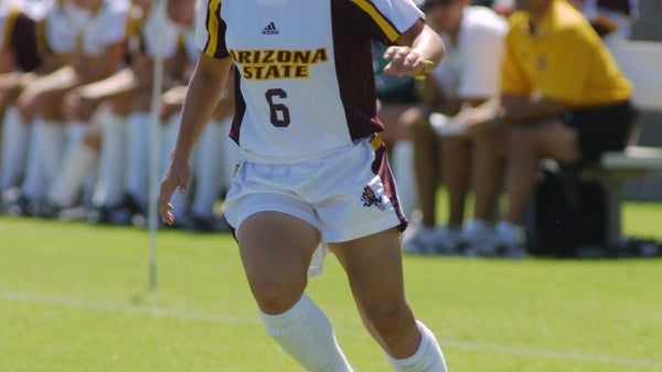 Arizona State softball player hitting the ball