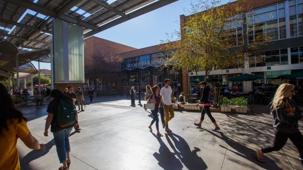 Students walk outside the ASU Memorial Union in Tempe