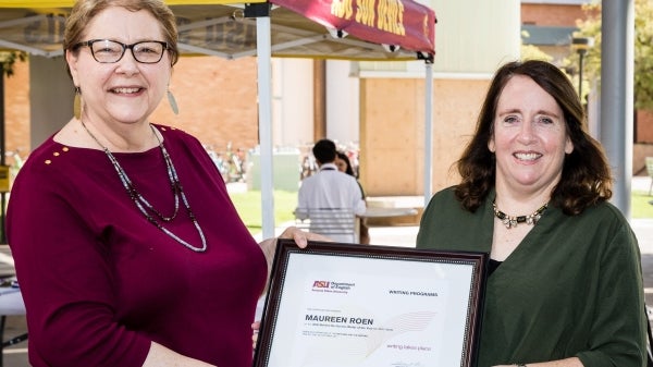 woman being presented with award