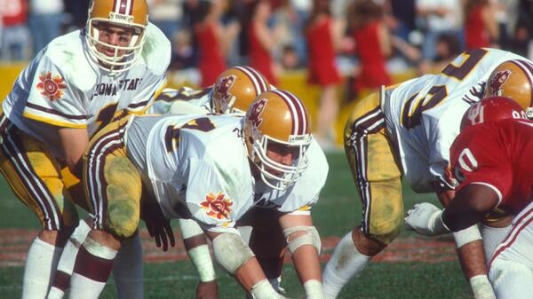 ASU quarterback Todd Hons getting ready to make a play on the field.