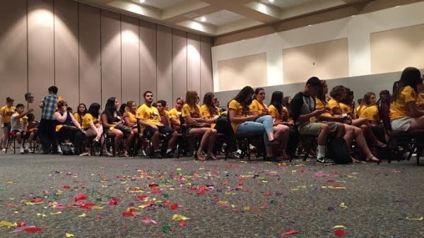 students sitting in ballroom