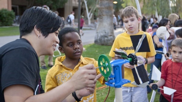 ASU scientist talks with Night of the Open Door visitor about wind energy