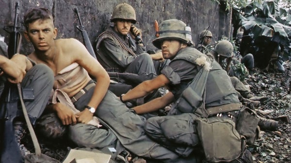 Soldiers tend to the wounded in the Vietnam War