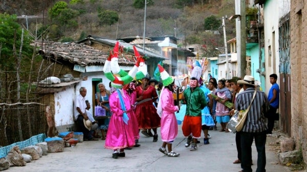 Nahua/Mexicano community dance in the streets during a celebration