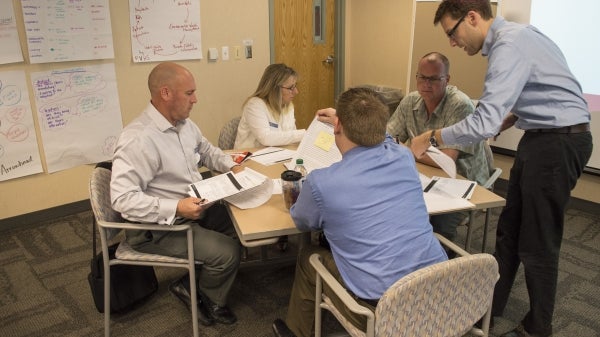 people haveing a discussion at a table