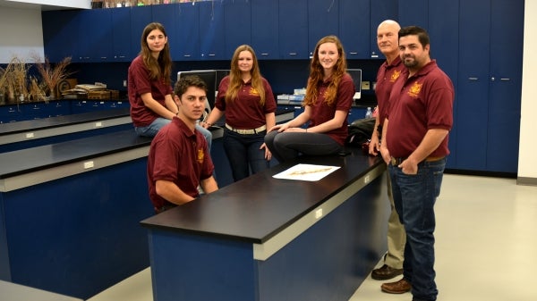 ASU's 2015 Society for Range Management competitors and faculty coach in lab