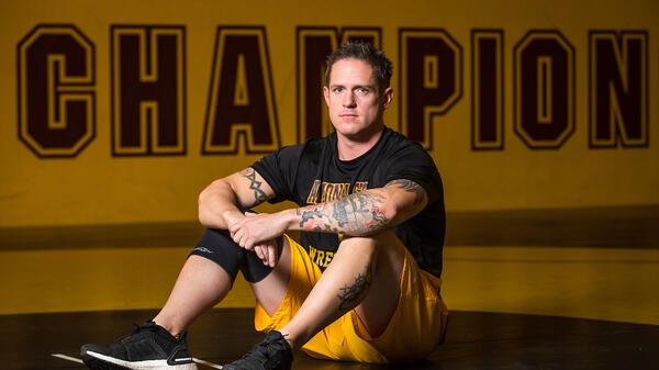 Wrestler sitting on a mat