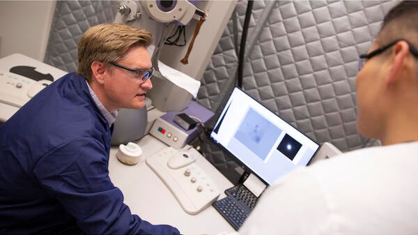 ASU Professor Brent Nannenga analyzes the composition of materials using an electron microscope.