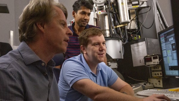 rofessor Peter Crozier and students in electron microscopy center