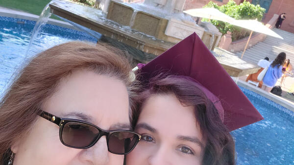 Graduating ASU student Shelly Smith-Phillips poses with her mother at the Kachina Fountain on ASU's Tempe campus. / Courtesy photo