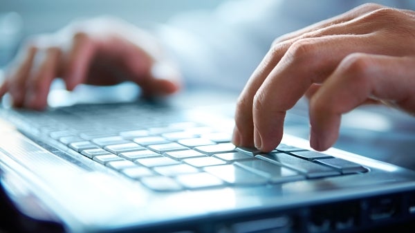 stock photo of hands typing