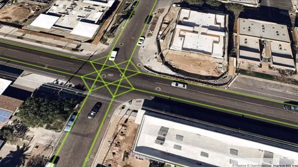 An arial image of an intersection with green gridlines overlaid on it