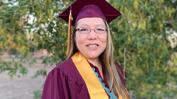 ASU graduate Stacee Tallman in her cap and gown