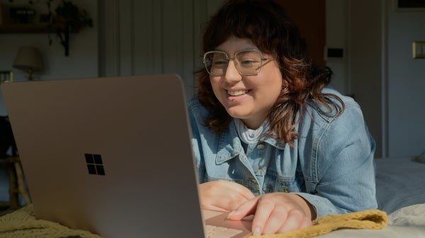 Young women looking at an open laptop screen