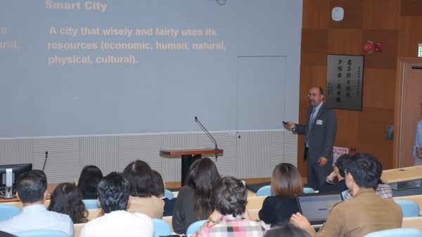 Rob Melnick presents about smart cities at Hong Kong event