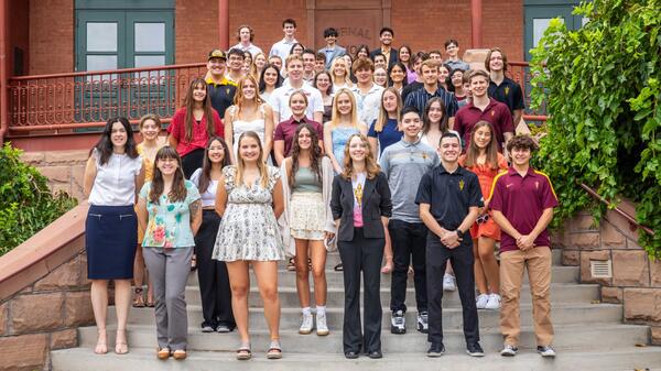 Group of ASU students gathered on the steps of the Old Main building on the Tempe campus.