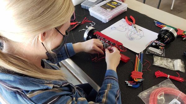 ASU robotics team Project Manager Andrea Schoonover assembling the pneumatics hull.