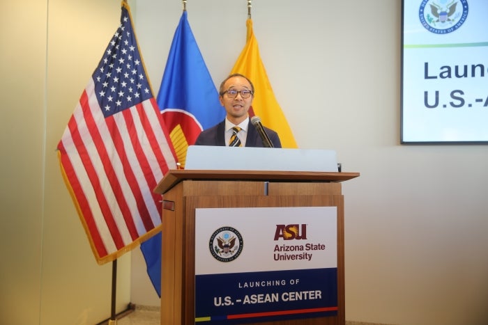 Man speaking at lectern at event