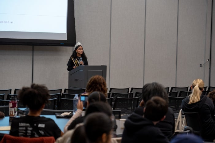 Sascha Reverón, the current Miss Juneteenth Arizona 2023, speaking to volunteers. 