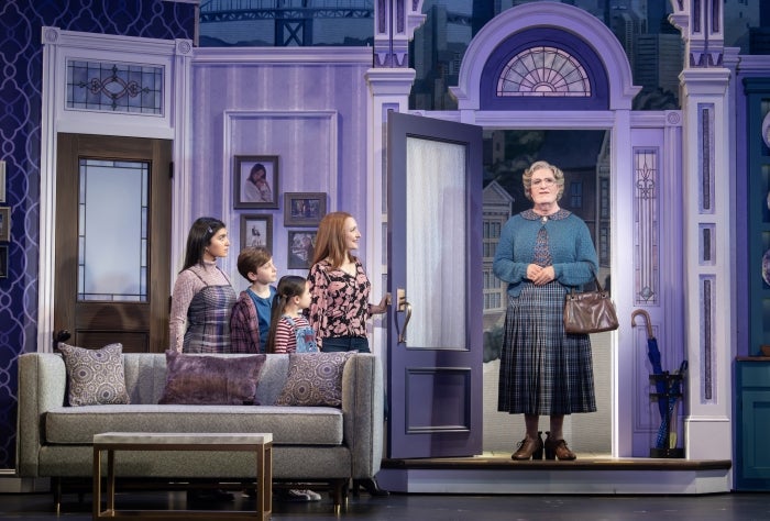 Scene from Broadway production of Mrs. Doubtfire with nanny entering house