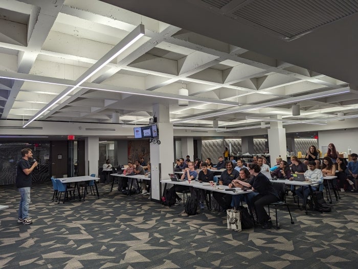 Eric Stribling speaking to the in-person participants of SpaceHACK