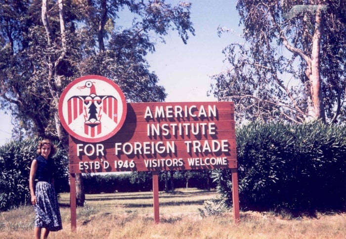 Woman in front of sign