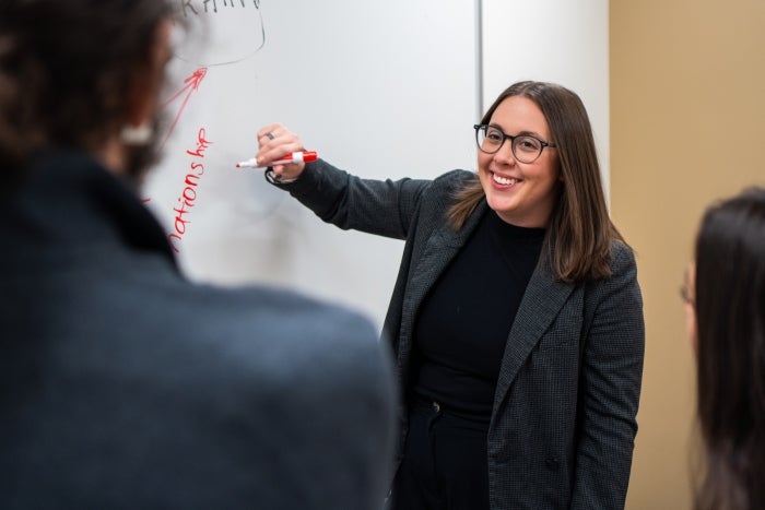 Alexandra Wormley collaborates with lab mates during a group meeting.