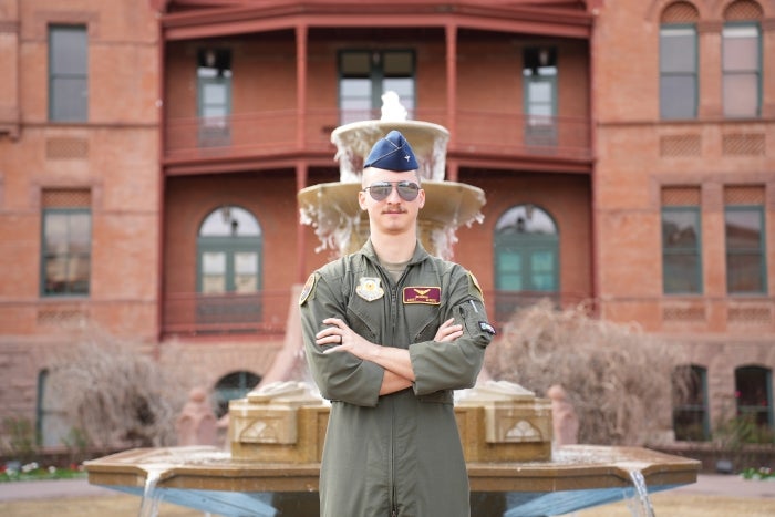 Joshua Bennion in front of Old Main. 