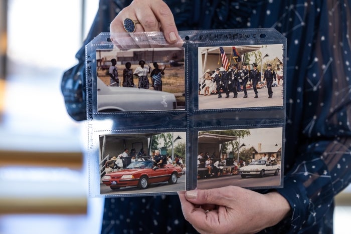 Woman holding series of photographs